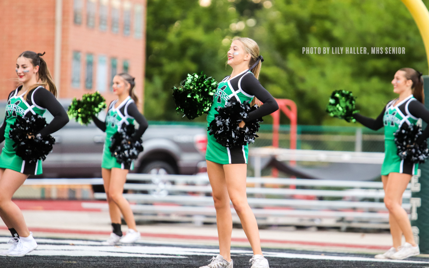 4 cheerleaders practicing