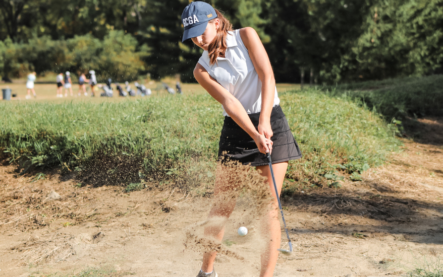 girl playing golf