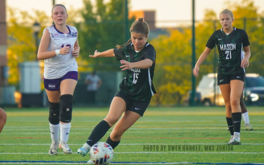 Mason girl preparing to kick ball