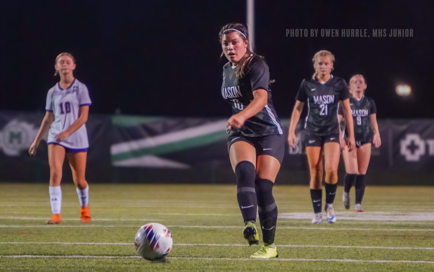 Mason girl preparing to kick the ball